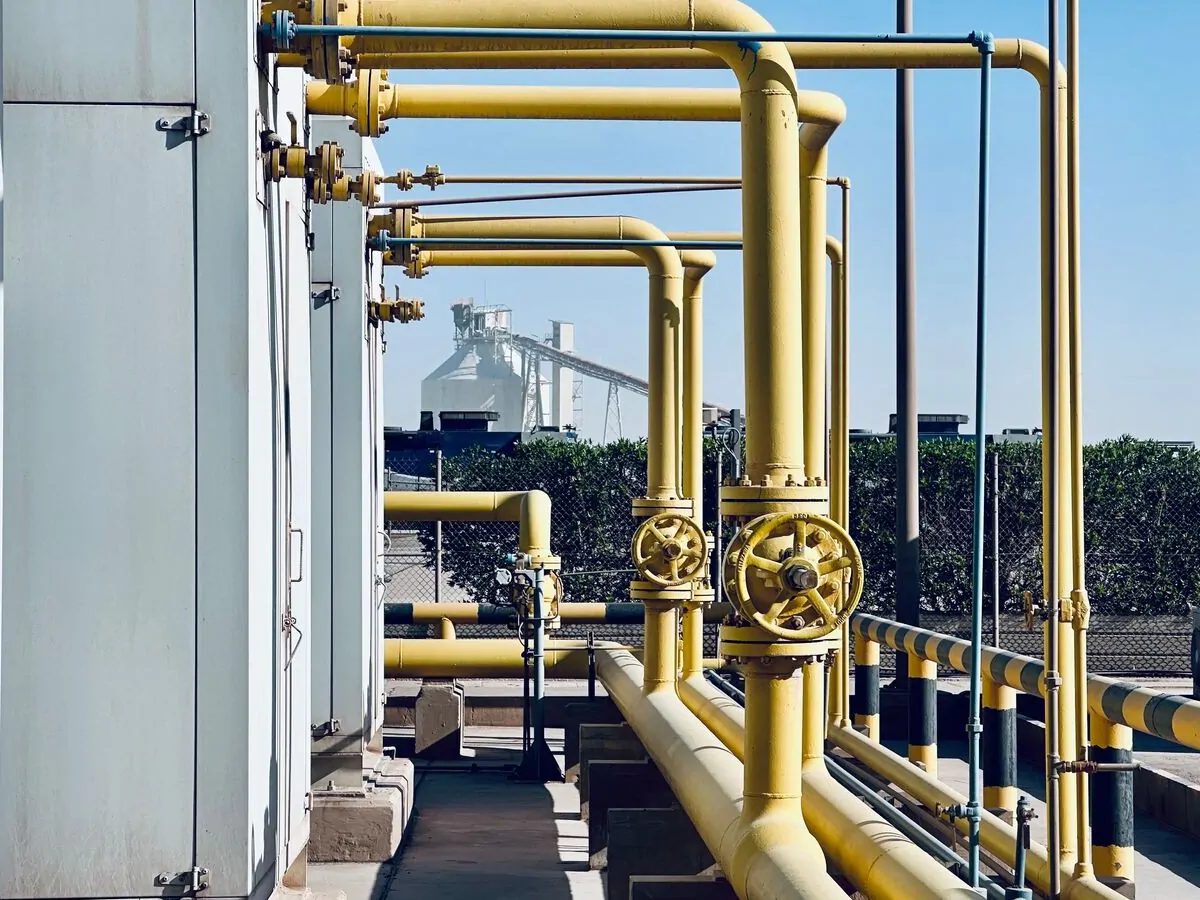 Yellow gas pipework and valves at an LPG bottling terminal