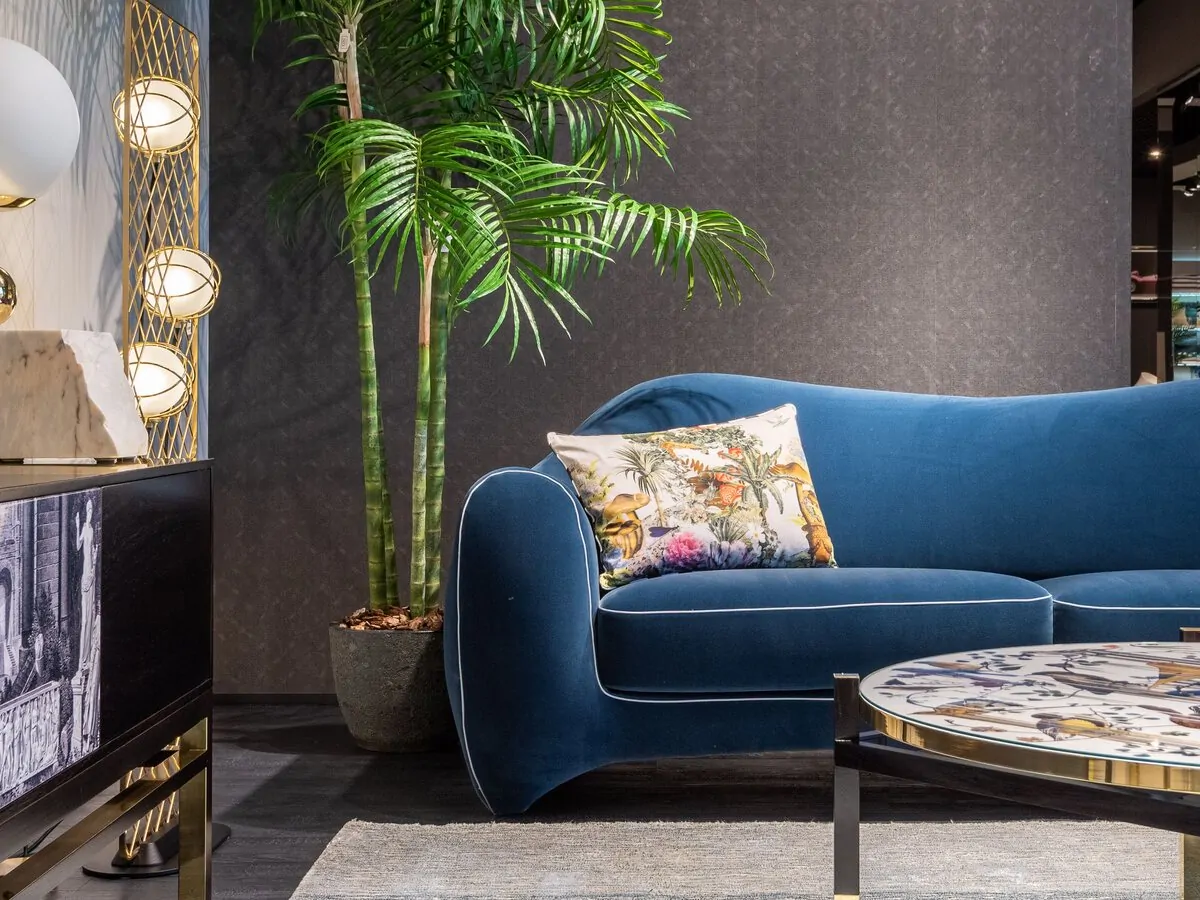 A furniture showroom display with sofa and lighting
