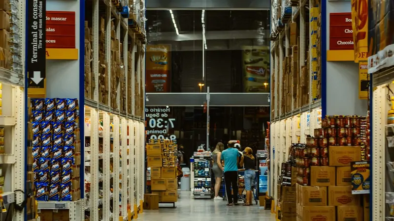 Shoppers in the aisle of a warehouse retail store