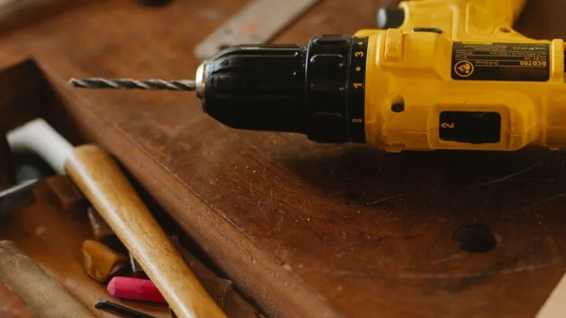 Power tools and timber on a workbench