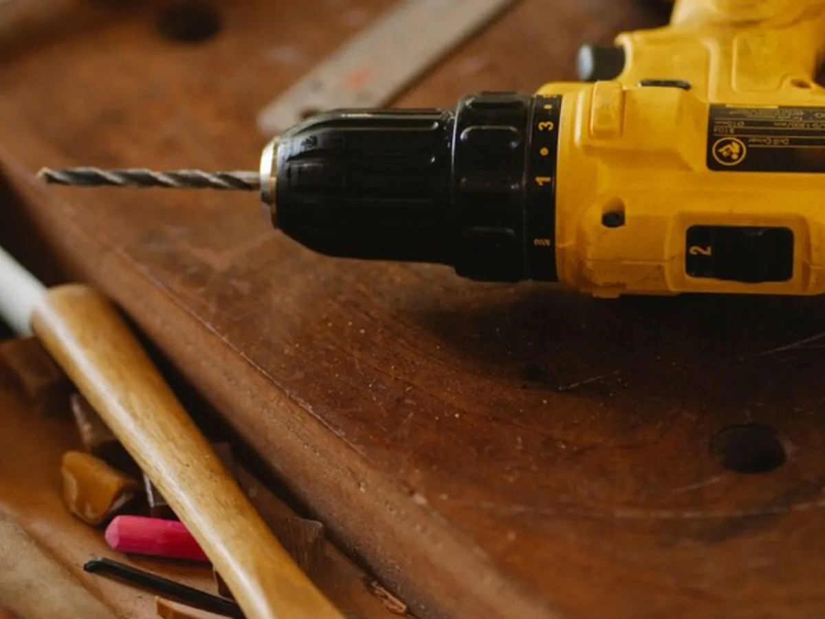 Power tools and timber on a workbench
